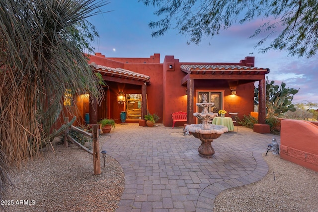 view of patio terrace at dusk