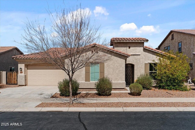 mediterranean / spanish house featuring stucco siding, driveway, and a tile roof