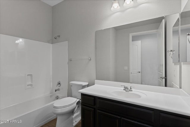 full bathroom with vanity, shower / bathtub combination, and toilet