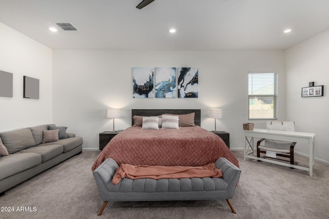 bedroom with ceiling fan and light colored carpet