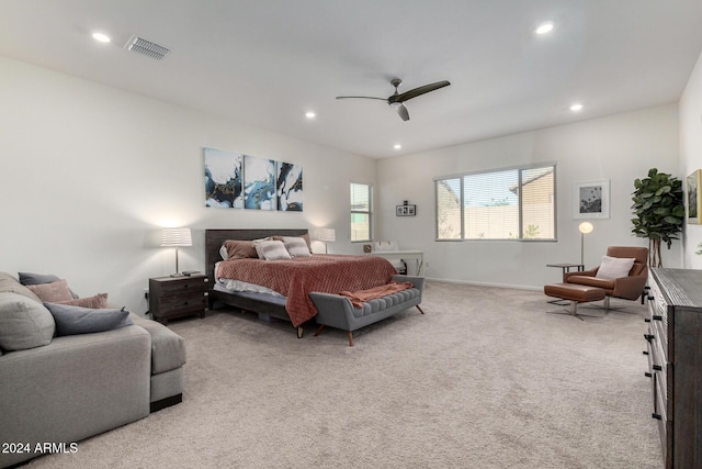 bedroom featuring ceiling fan and light carpet