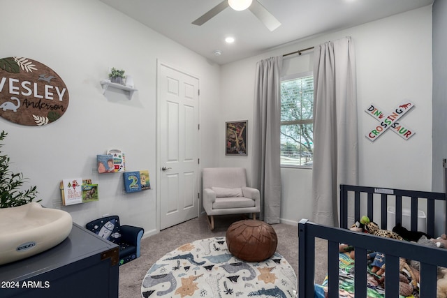 carpeted bedroom with ceiling fan