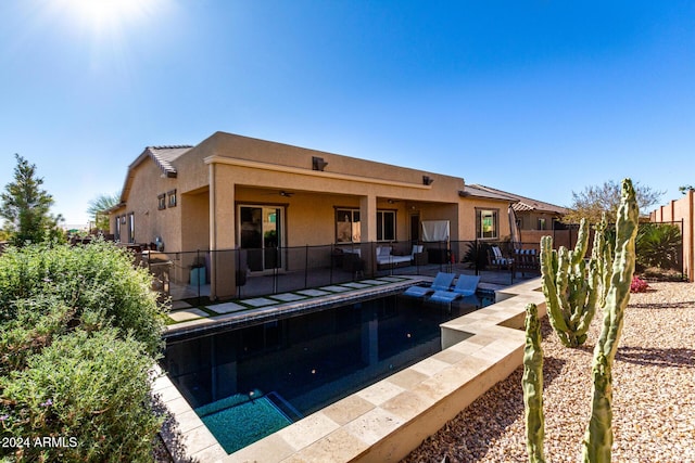 view of pool featuring a patio and ceiling fan