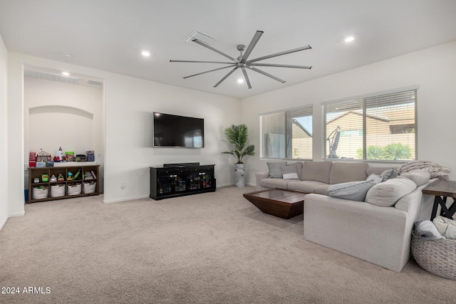 carpeted living room featuring ceiling fan