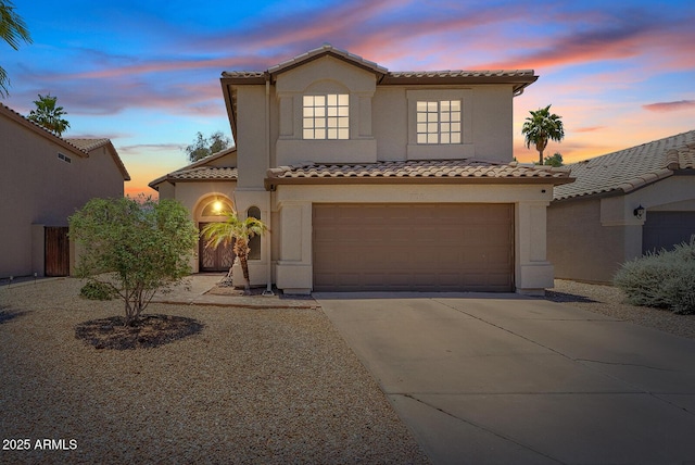 706 N El Dorado Dr, Gilbert, AZ 85233 - mediterranean / spanish home with a tile roof, concrete driveway, stucco siding, and an attached garage