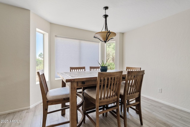 706 N El Dorado Dr, Gilbert, AZ 85233 - dining room with light wood-type flooring and baseboards