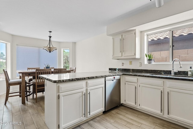 706 N El Dorado Dr, Gilbert, AZ 85233 - kitchen featuring stainless steel dishwasher, a sink, a peninsula, white cabinetry, and light wood-type flooring