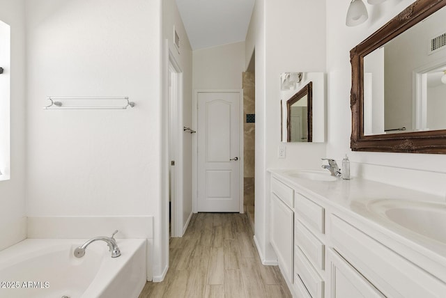 706 N El Dorado Dr, Gilbert, AZ 85233 - bathroom featuring double vanity and a garden tub