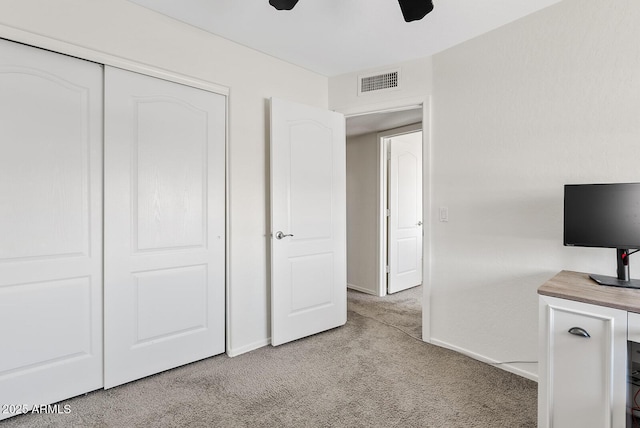 706 N El Dorado Dr, Gilbert, AZ 85233 - unfurnished bedroom featuring light colored carpet, baseboards, a closet, and a ceiling fan