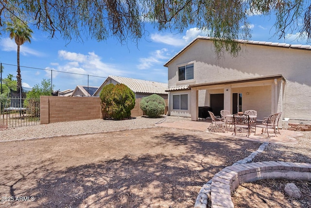 706 N El Dorado Dr, Gilbert, AZ 85233 - rear view of house with stucco siding and a patio area
