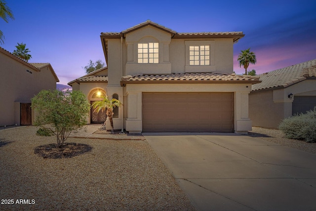 706 N El Dorado Dr, Gilbert, AZ 85233 - mediterranean / spanish-style house with a tile roof, concrete driveway, stucco siding, and an attached garage