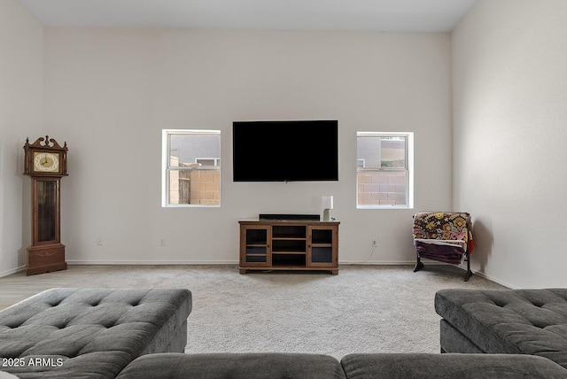 706 N El Dorado Dr, Gilbert, AZ 85233 - living area with healthy amount of natural light, baseboards, and light colored carpet