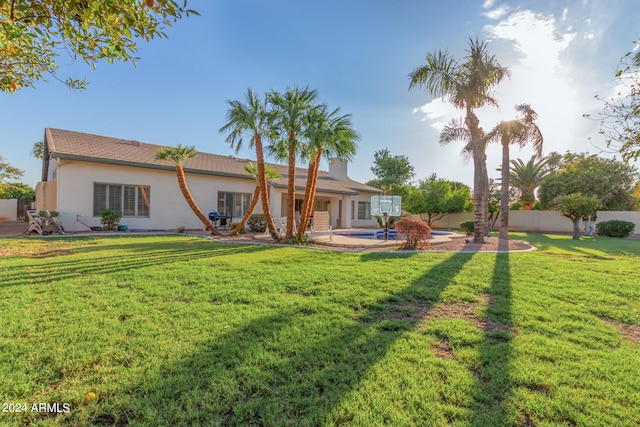 exterior space featuring a lawn and a patio