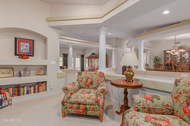 interior space with a chandelier and decorative columns