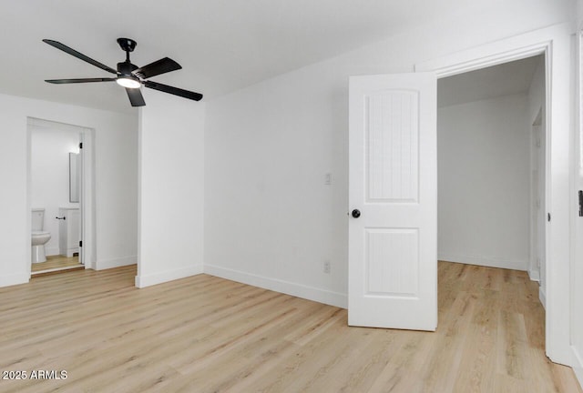 unfurnished bedroom with ceiling fan, light hardwood / wood-style floors, and connected bathroom