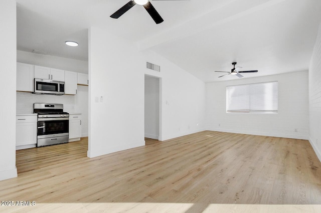 unfurnished living room featuring vaulted ceiling with beams, light hardwood / wood-style floors, and ceiling fan