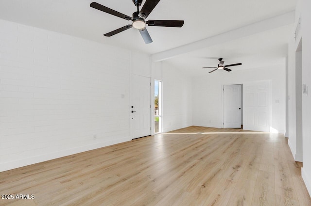 unfurnished room featuring vaulted ceiling with beams, ceiling fan, and light hardwood / wood-style floors