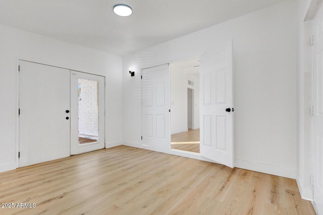 entryway with hardwood / wood-style flooring