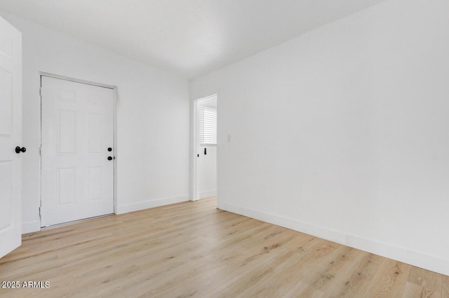 spare room with light wood-type flooring