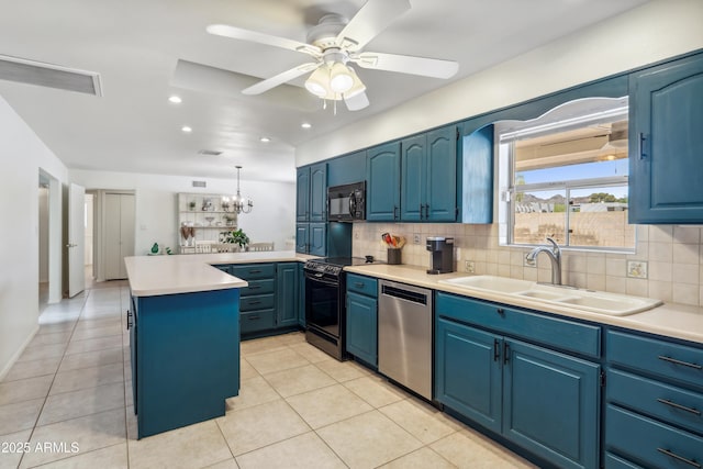 8135 N 5th St, Phoenix, AZ 85020 - kitchen featuring black appliances, a sink, blue cabinets, backsplash, and a peninsula