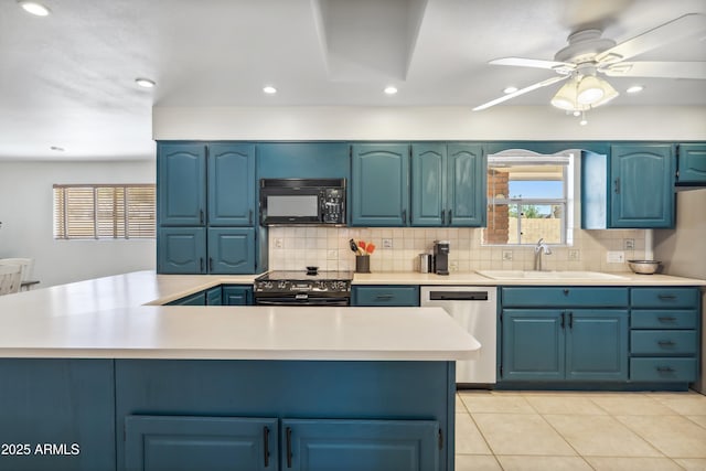 8135 N 5th St, Phoenix, AZ 85020 - kitchen with black appliances, a sink, blue cabinetry, light countertops, and backsplash