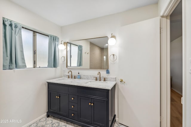 8135 N 5th St, Phoenix, AZ 85020 - bathroom featuring double vanity and baseboards