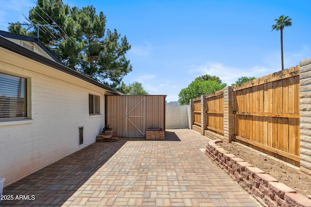 8135 N 5th St, Phoenix, AZ 85020 - view of patio featuring a shed, an outbuilding, and a fenced backyard