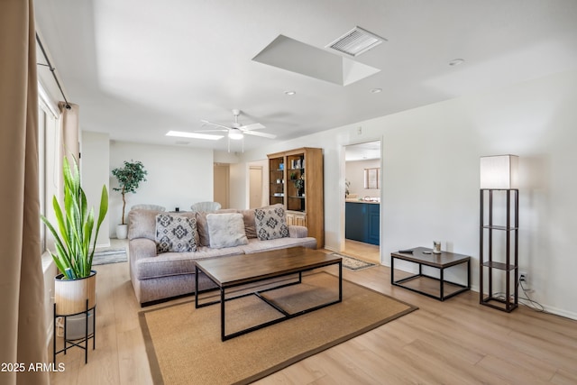 8135 N 5th St, Phoenix, AZ 85020 - living area with a skylight, light wood-style floors, a ceiling fan, and recessed lighting