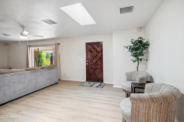 8135 N 5th St, Phoenix, AZ 85020 - living area featuring light wood-type flooring, baseboards, and a skylight