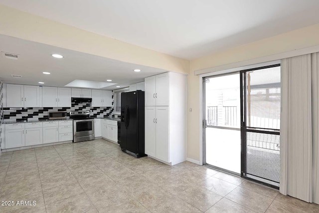 kitchen featuring stainless steel appliances, visible vents, backsplash, white cabinets, and under cabinet range hood