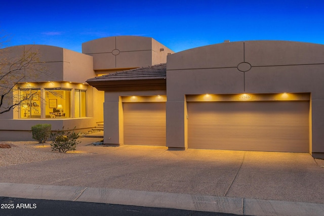 13621 E Aster Dr, Scottsdale, AZ 85259 - southwest-style home featuring a tile roof, driveway, a garage, and stucco siding