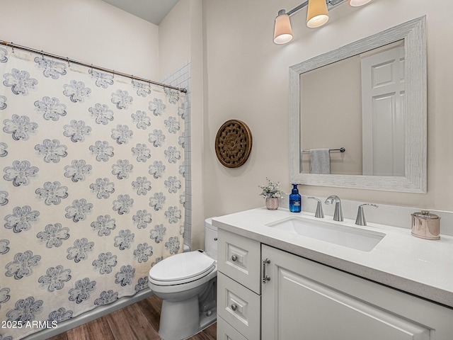 13621 E Aster Dr, Scottsdale, AZ 85259 - bathroom featuring a shower with shower curtain, wood finished floors, toilet, and vanity