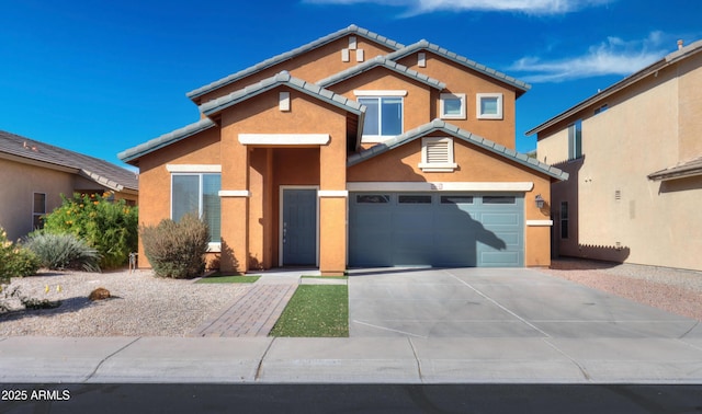 view of front facade featuring a tile roof, driveway, an attached garage, and stucco siding