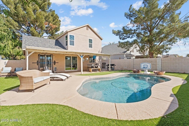 view of swimming pool featuring a fenced in pool, a fenced backyard, a patio, and ceiling fan