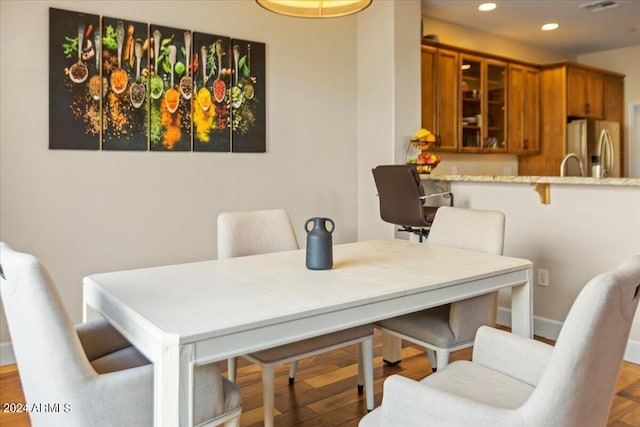 dining area with wood-type flooring