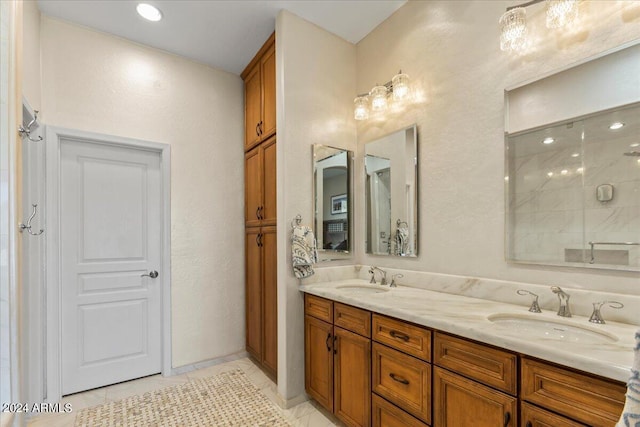 bathroom with tile patterned flooring, vanity, and a shower