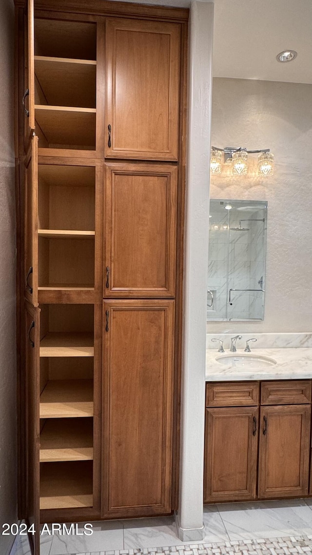 bathroom with vanity and an enclosed shower