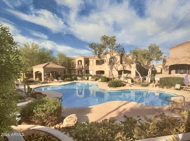 view of swimming pool featuring a gazebo and a patio area