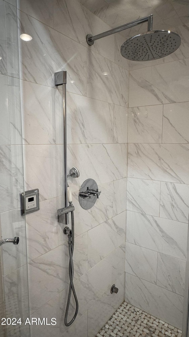 bathroom with a tile shower