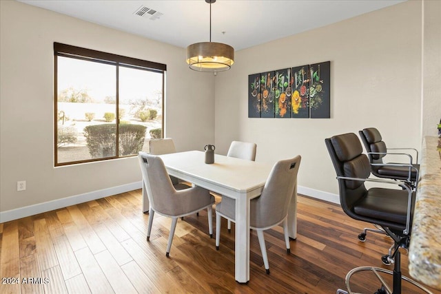 dining room with hardwood / wood-style flooring