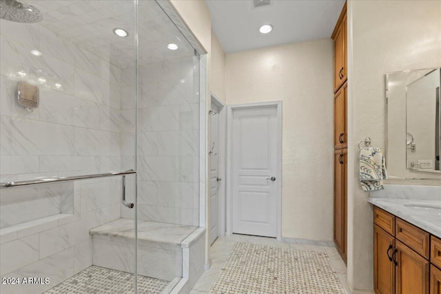 bathroom with vanity, tile patterned floors, and walk in shower