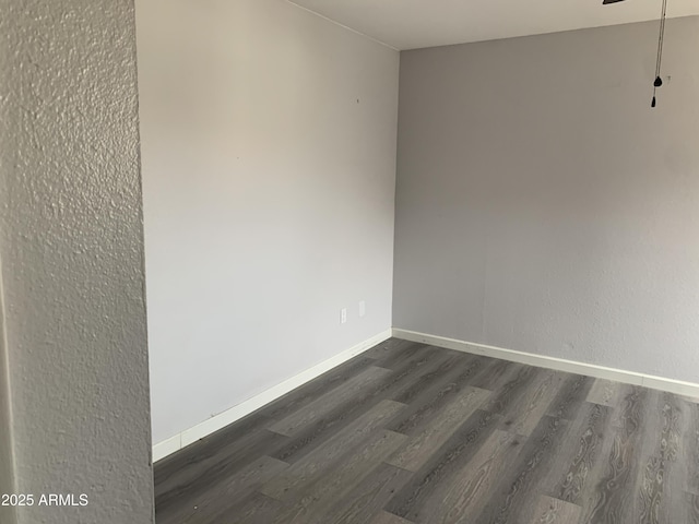 unfurnished room featuring dark hardwood / wood-style floors