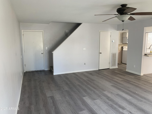 unfurnished living room featuring hardwood / wood-style flooring and ceiling fan