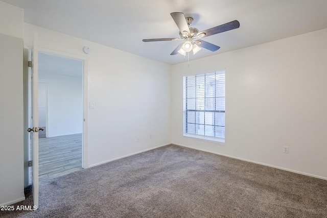 carpeted empty room with ceiling fan