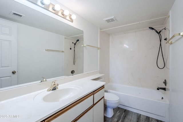 full bathroom with hardwood / wood-style flooring, vanity, washtub / shower combination, and toilet