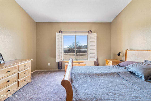 carpeted bedroom with baseboards