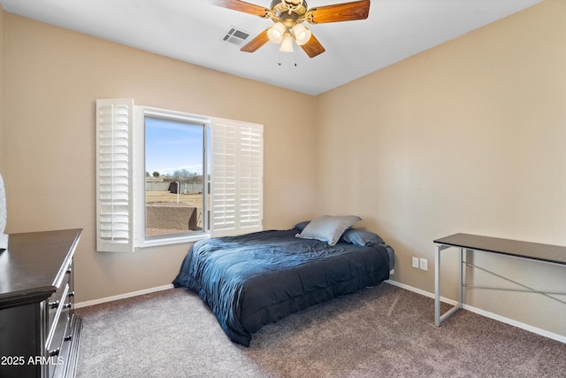 carpeted bedroom with visible vents, ceiling fan, and baseboards