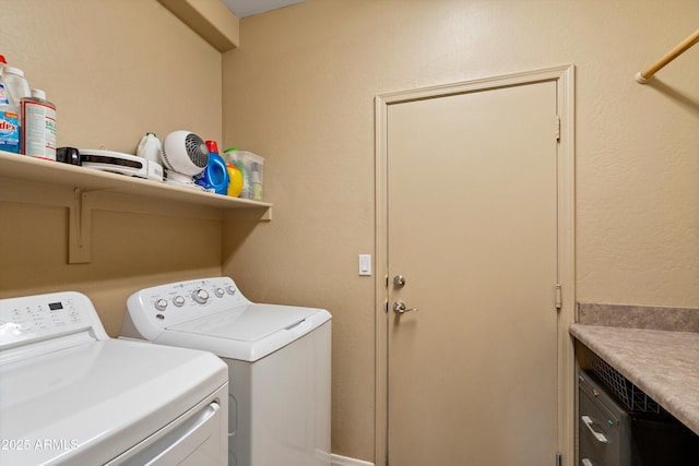 laundry area with laundry area and washer and clothes dryer