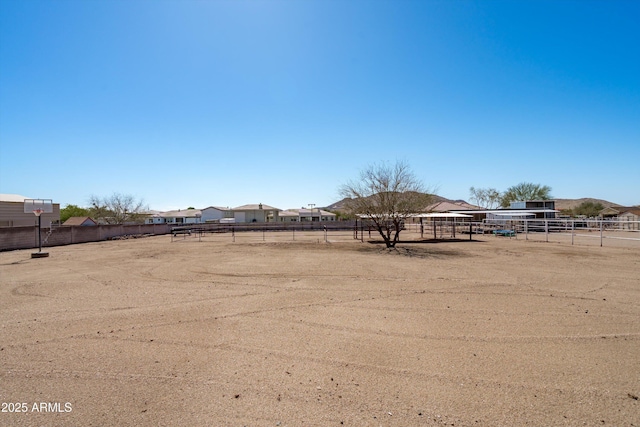 view of yard featuring an enclosed area and fence