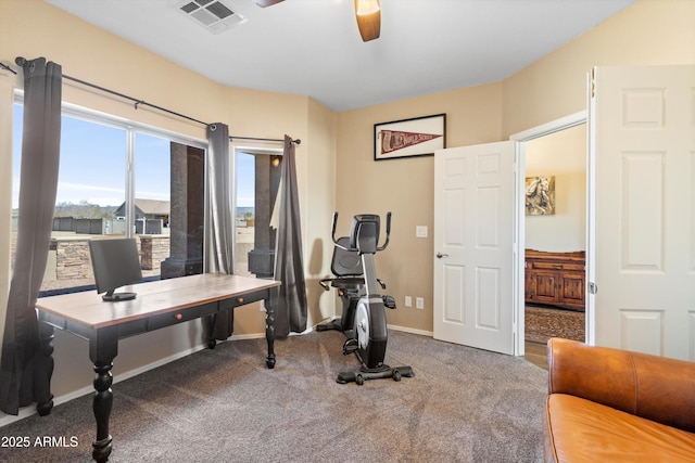 exercise area featuring visible vents, a ceiling fan, baseboards, and carpet floors